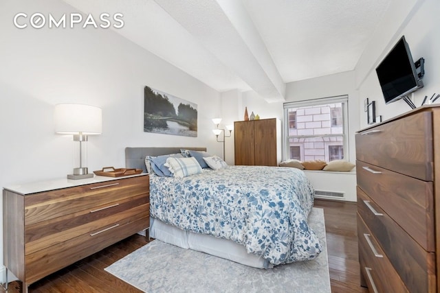 bedroom featuring dark wood-style floors