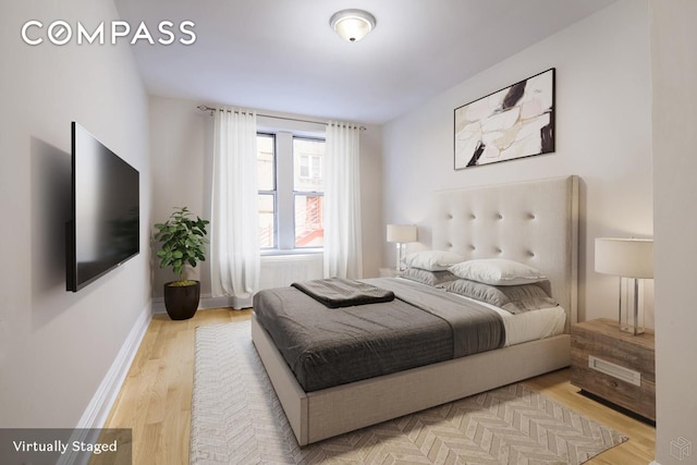 156-08 Riverside Dr W Unit 1K, New York City, NY 10032 - bedroom featuring light wood-style floors and baseboards
