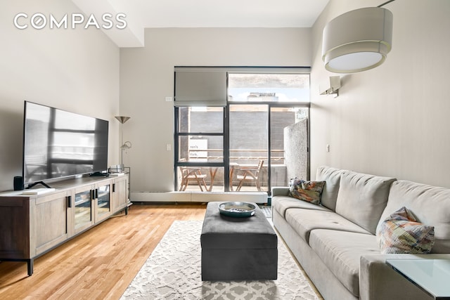 350 E 62nd St Unit 4B, New York City, NY 10065 - living area with light wood-style flooring