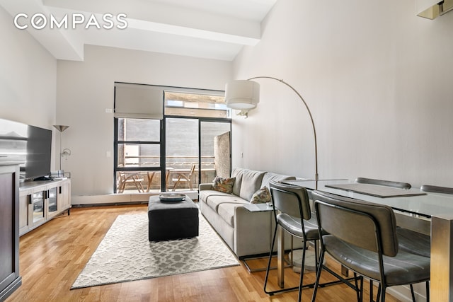 350 E 62nd St Unit 4B, New York City, NY 10065 - living room with light wood-type flooring and beam ceiling