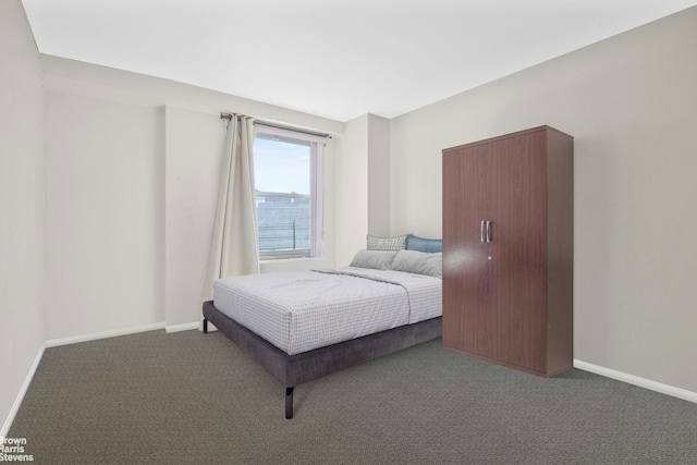 carpeted bedroom with baseboards