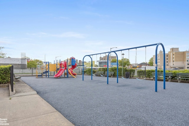 communal playground featuring fence