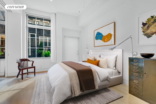 bedroom with light wood-style flooring