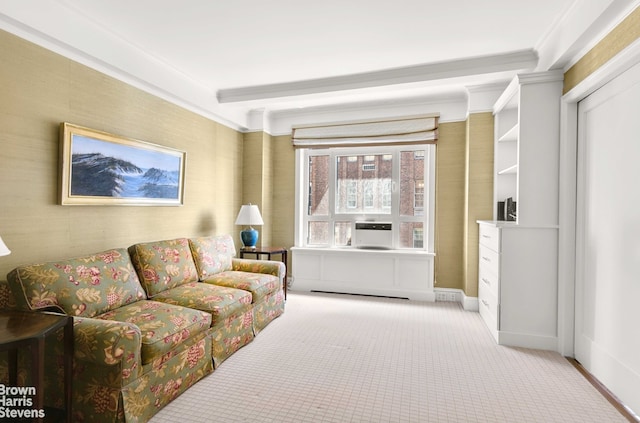 carpeted living room featuring baseboards and crown molding
