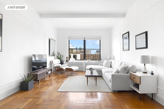 living area with radiator heating unit and baseboards