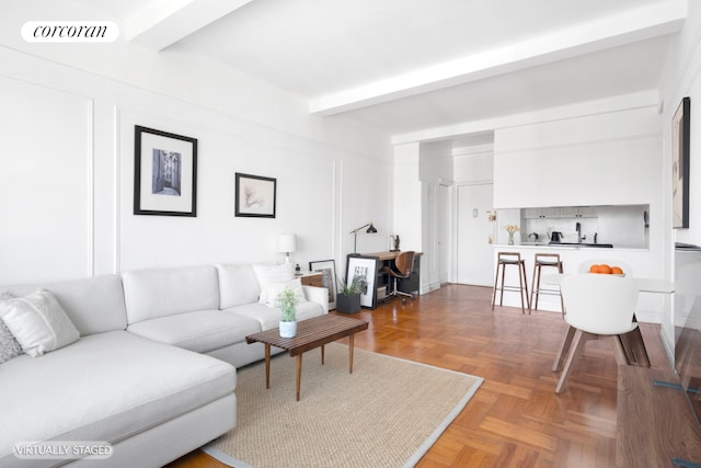 living room featuring beamed ceiling