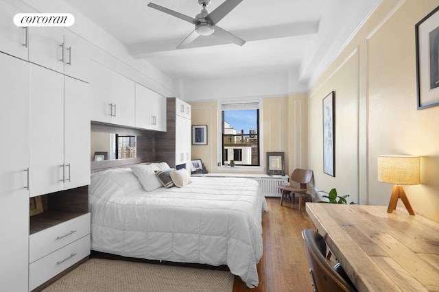 bedroom with wood finished floors and a ceiling fan