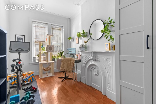 139 N 8th St, New York City, NY 11249 - office area featuring ornamental molding, light wood-style flooring, and baseboards