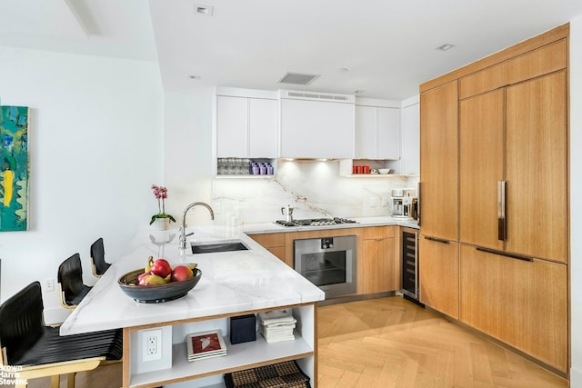 78 Amity St Unit 2F, New York City, NY 11201 - kitchen featuring stainless steel appliances, a peninsula, a sink, wine cooler, and modern cabinets