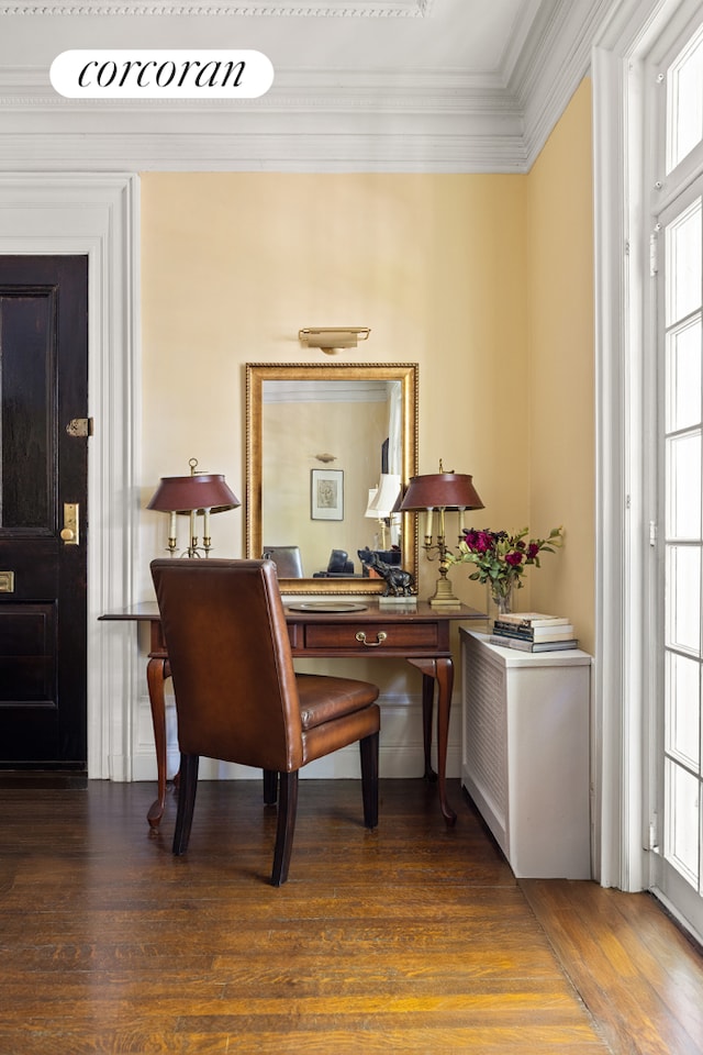 home office with ornamental molding and wood finished floors