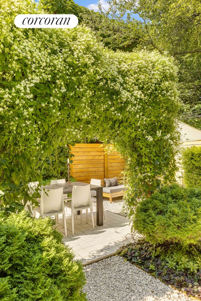 view of patio / terrace featuring fence