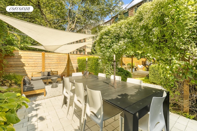 view of patio / terrace with outdoor dining area and a fenced backyard