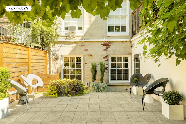 view of patio featuring fence and cooling unit
