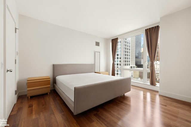250 E 53rd St Unit 1502, New York City, NY 10022 - bedroom featuring wood finished floors