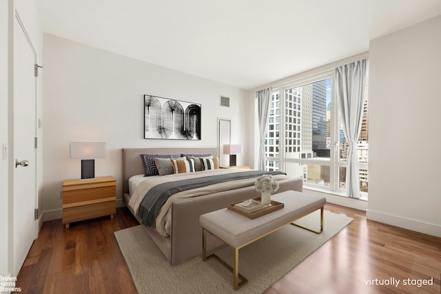250 E 53rd St Unit 1502, New York City, NY 10022 - bedroom featuring wood finished floors