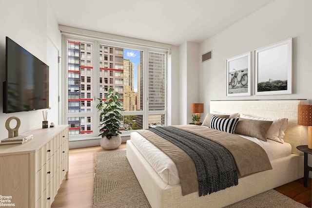 250 E 53rd St Unit 1502, New York City, NY 10022 - bedroom featuring light wood-style floors