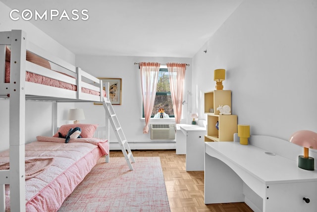 2235 Frederick Douglass Blvd Unit 2L, New York City, NY 10027 - bedroom featuring an AC wall unit, a desk, and baseboard heating