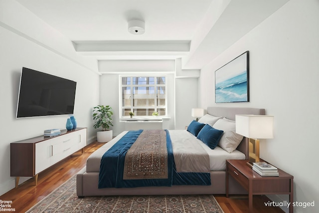 bedroom with wood finished floors