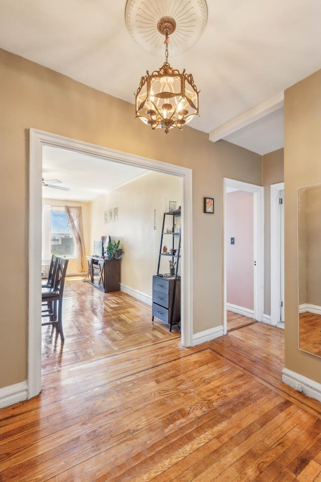 1075 Grand Concourse Unit 4G, New York City, NY 10452 - entrance foyer featuring a chandelier, baseboards, and light wood finished floors
