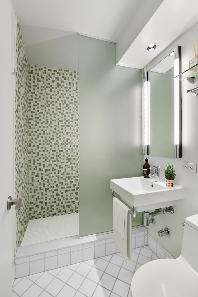 411 E 53rd St Unit 19D, New York City, NY 10022 - bathroom with toilet, a shower stall, and tile patterned floors