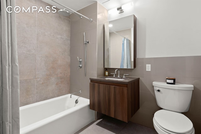 bathroom with shower / bath combo with shower curtain, toilet, and vanity