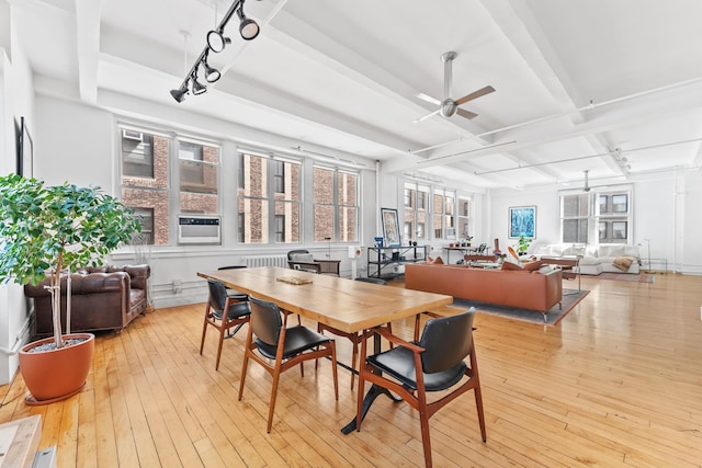7 E 20th St Unit 11-R, New York City, NY 10003 - sunroom featuring coffered ceiling, beamed ceiling, track lighting, and radiator heating unit