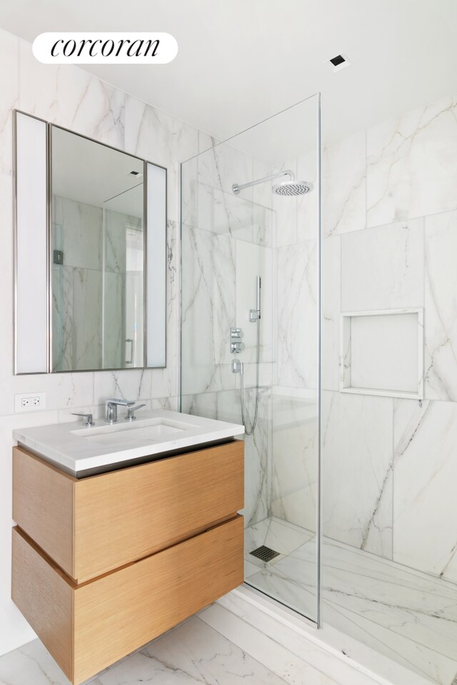 450 Washington St Unit 705, New York City, NY 10013 - full bathroom featuring marble finish flooring, vanity, and a marble finish shower