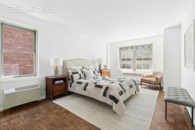 1199 Park Ave Unit 2F, New York City, NY 10128 - bedroom with radiator heating unit and a wall mounted AC