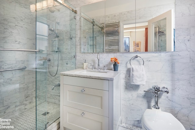 full bath featuring tile walls, a shower stall, and vanity