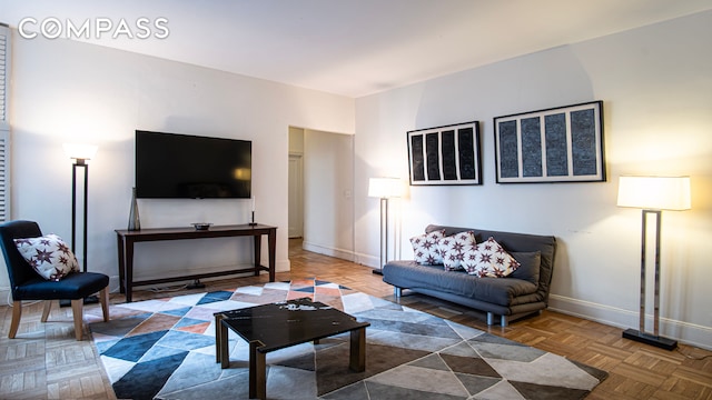 907 5th Ave Unit 4F, New York City, NY 10021 - living area featuring baseboards