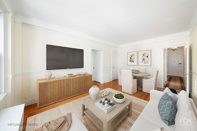 255 W End Ave Unit 12C, New York City, NY 10023 - living room featuring a decorative wall, wood finished floors, and a chandelier