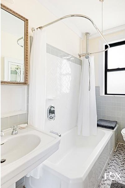 255 W End Ave Unit 12C, New York City, NY 10023 - full bathroom featuring shower / bath combo with shower curtain and toilet