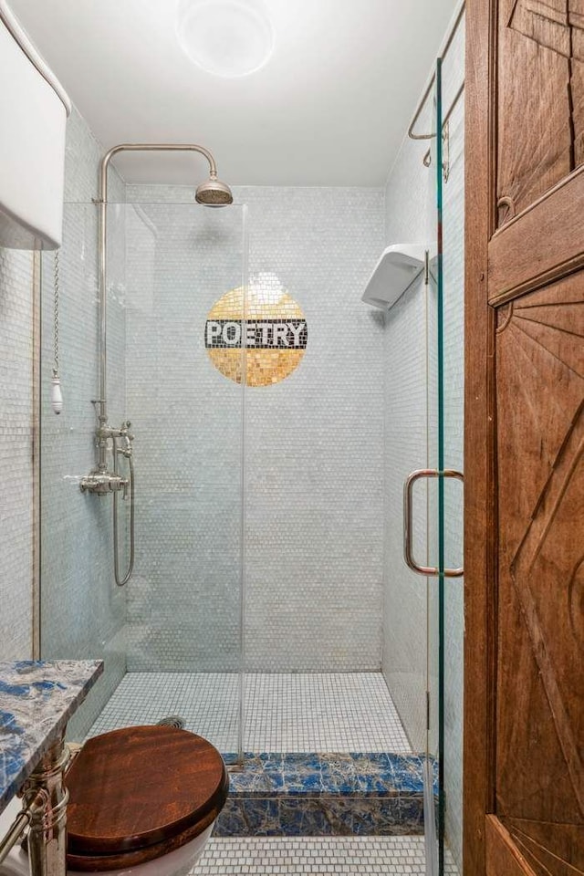149 E 18th St Unit 2, New York City, NY 10003 - full bathroom featuring a stall shower, toilet, and tile patterned floors