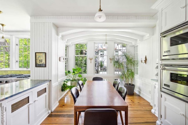 149 E 18th St Unit 2, New York City, NY 10003 - dining space with light wood-style floors and a decorative wall