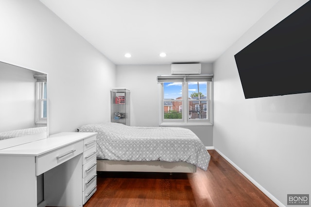 82-15 Penelope Ave, New York City, NY 11379 - bedroom with a wall mounted air conditioner, dark wood-style flooring, baseboards, and recessed lighting