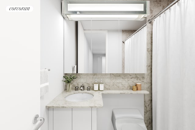 300 E 40th St Unit 10N, New York City, NY 10016 - full bathroom featuring vanity and decorative backsplash