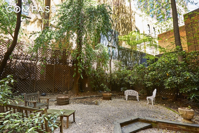 view of yard with a fire pit