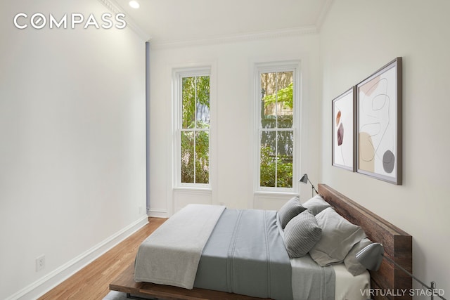 157 E 75th St Unit 1E, New York City, NY 10021 - bedroom with wood finished floors, baseboards, crown molding, and recessed lighting