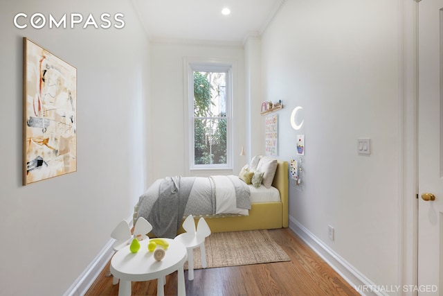 157 E 75th St Unit 1E, New York City, NY 10021 - bedroom featuring crown molding, baseboards, and wood finished floors