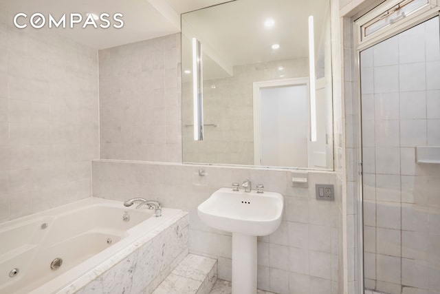 157 E 75th St Unit 1E, New York City, NY 10021 - full bathroom with tile walls and a whirlpool tub