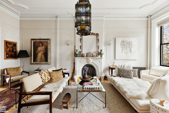 185 12th St, New York City, NY 11215 - living room with wood finished floors, crown molding, and a fireplace