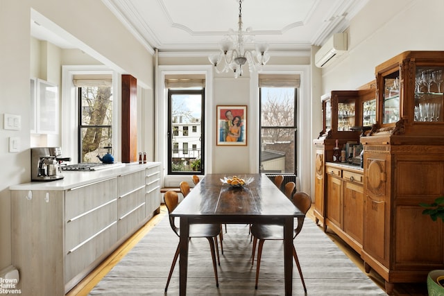 185 12th St, New York City, NY 11215 - dining space with a wall mounted AC, a chandelier, light wood-style floors, and crown molding