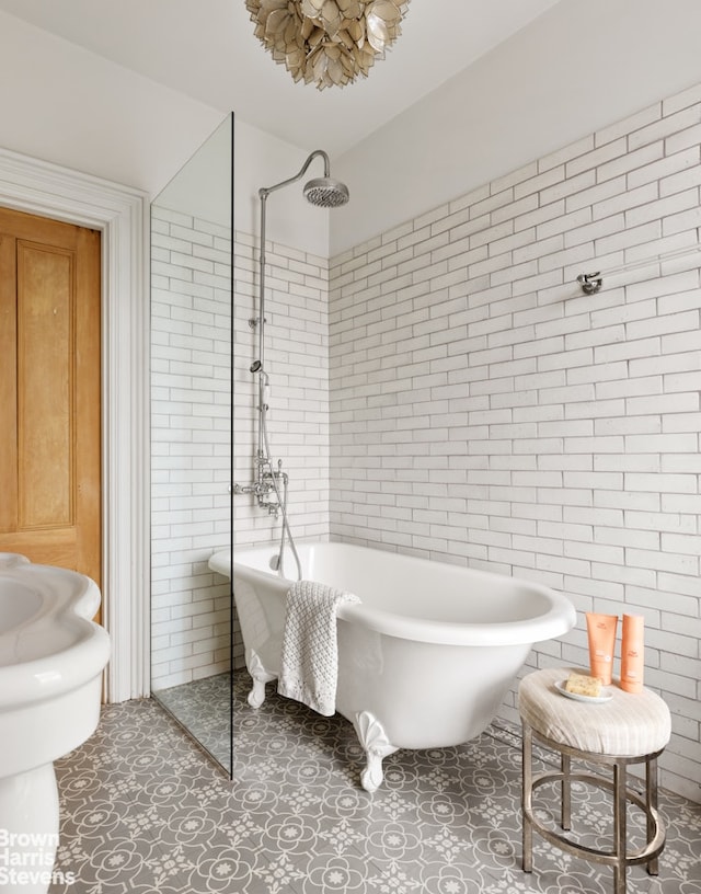185 12th St, New York City, NY 11215 - full bathroom with tile walls, a freestanding bath, tiled shower, and tile patterned flooring