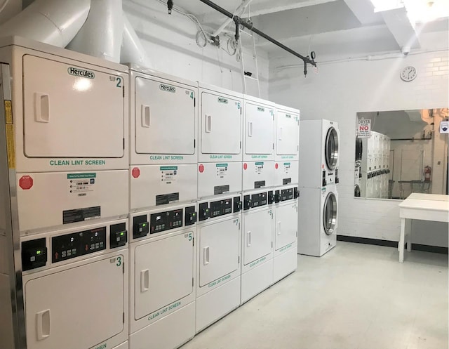 community laundry room featuring stacked washer / dryer and washer and dryer