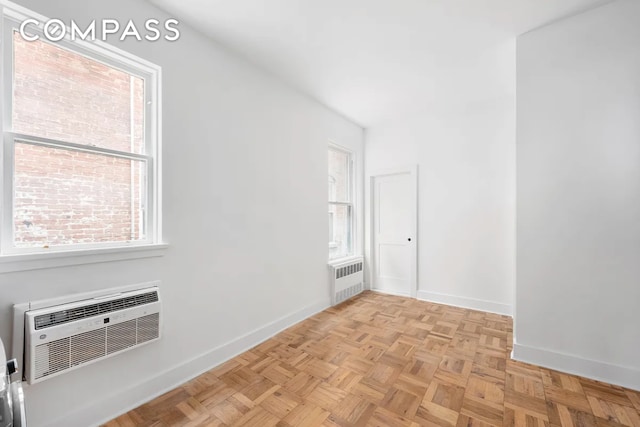 151 W 80th St Unit 4F, New York City, NY 10024 - spare room with radiator heating unit, baseboards, and a wall unit AC