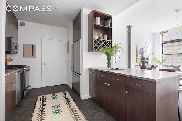 kitchen with appliances with stainless steel finishes, open shelves, a peninsula, dark brown cabinets, and light countertops