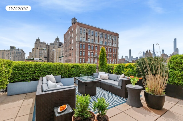 view of patio / terrace featuring a skyline view and an outdoor hangout area