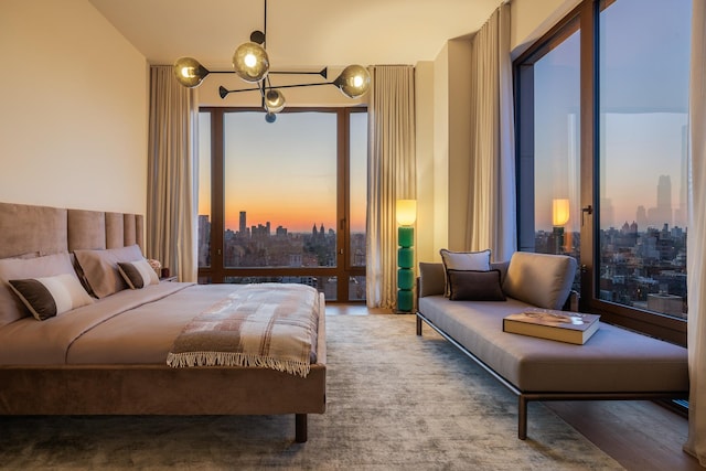 bedroom featuring multiple windows and a view of skyline