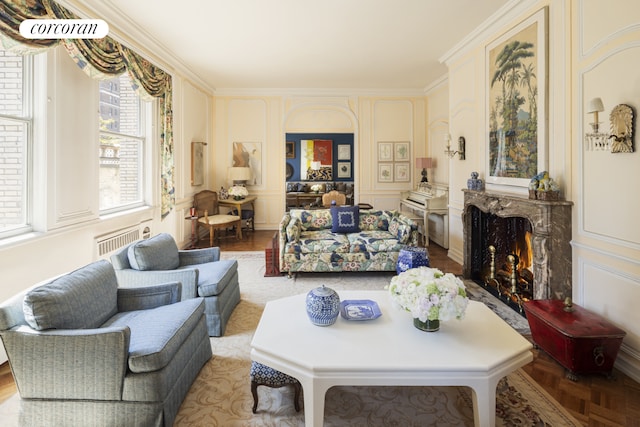 living area with a decorative wall and radiator heating unit
