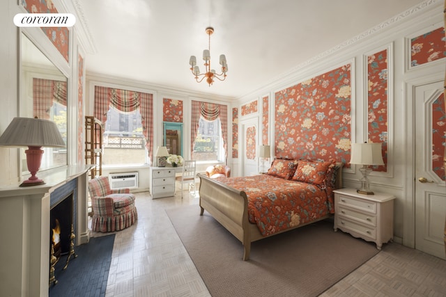 bedroom featuring a chandelier, wallpapered walls, a decorative wall, an AC wall unit, and ornamental molding